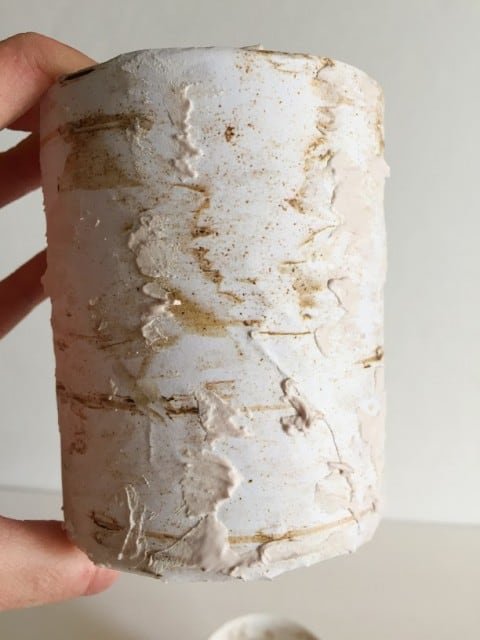 paper glued on to vase