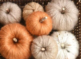 How to Make Chunky Yarn Pumpkins: Cozy Fall Decor Chunky yarn pumpkin in a basket with many others