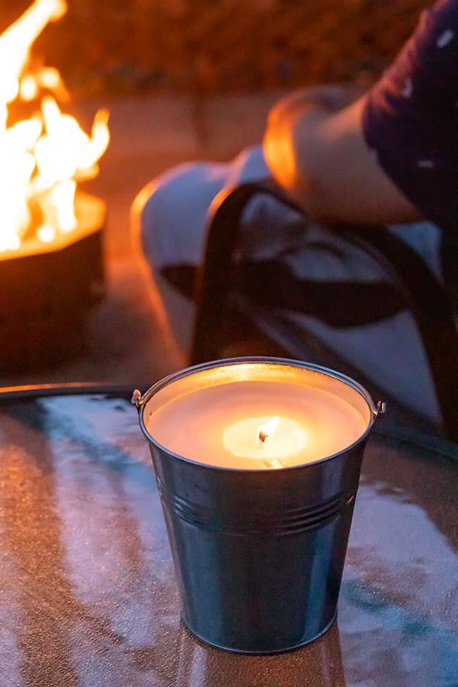 Citronella candle lit outside on a summer night