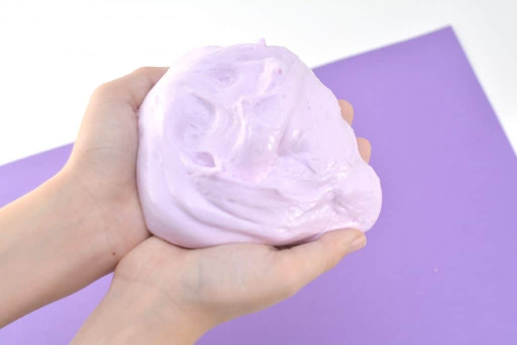 A close up of a hand and slime