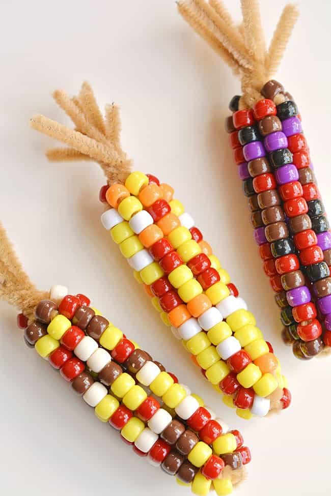 This beaded pipe cleaner Indian corn craft is SO FUN! And it's so simple to make. All you need are two simple supplies that you can usually find at the dollar store. This is such a fun and easy kids craft and a super fun Thanksgiving activity. I love how realistic they end up looking!