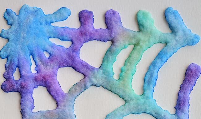 Salt Painting Halloween Craft: Step-by-Step Guide This salt painted Halloween craft is SO MUCH FUN! This is such a cool Halloween craft for kids! The shapes puff off the paper and end up looking 3D with a really cool crystal-like texture. You can make any shapes you like! There's even free pumpkin and spiderweb templates you can print off so you can easily make some spooky Halloween art!