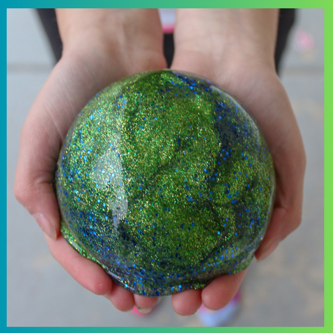 slime shaped like world in hands