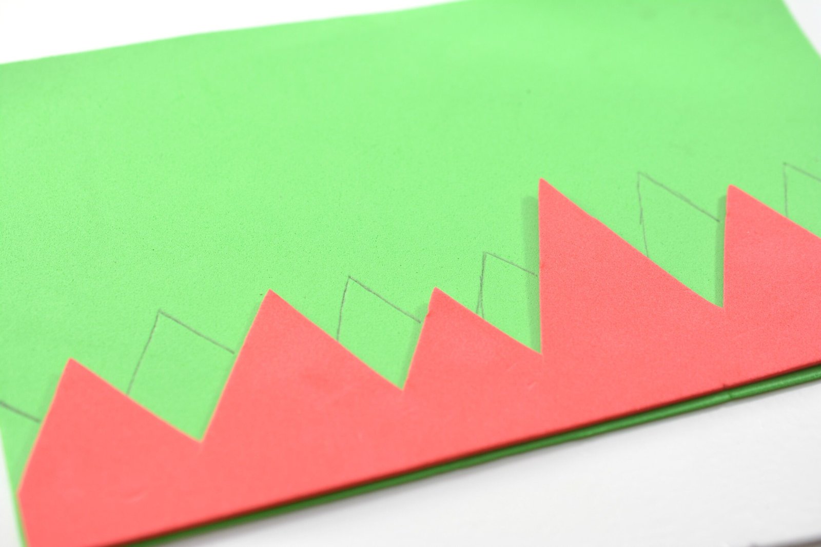 Drawing triangles on the green craft foam