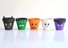DIY Halloween Clay Pots: Fun and Spooky Crafts Halloween clay pots painted like a black cat, Frankenstein, jack-o-lantern, ghost, and vampire