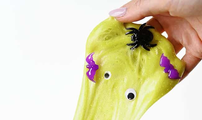 Halloween Slime Recipe Green Halloween slime filled with googly eyes, bats, and spiders