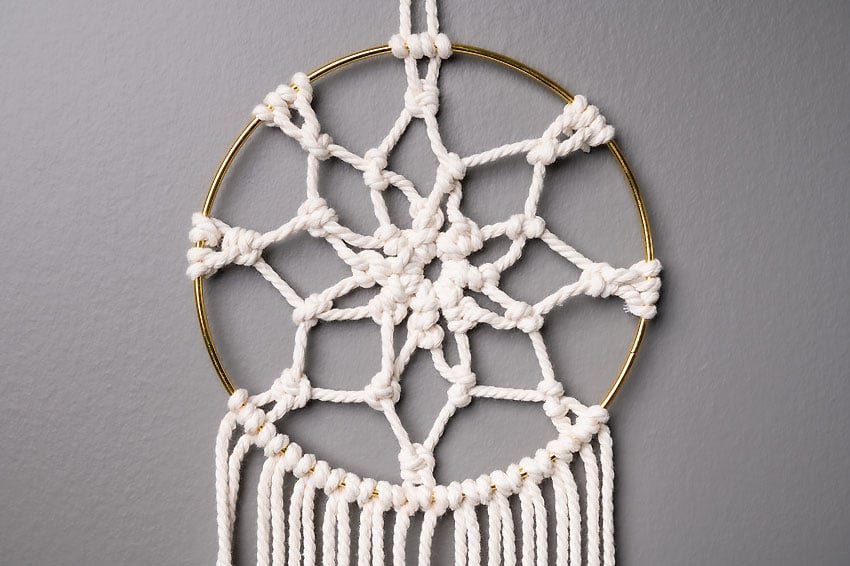 Closeup on the hoop of a DIY macrame dream catcher