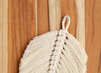How to Make a Macrame Feather Macrame feather on a wooden background