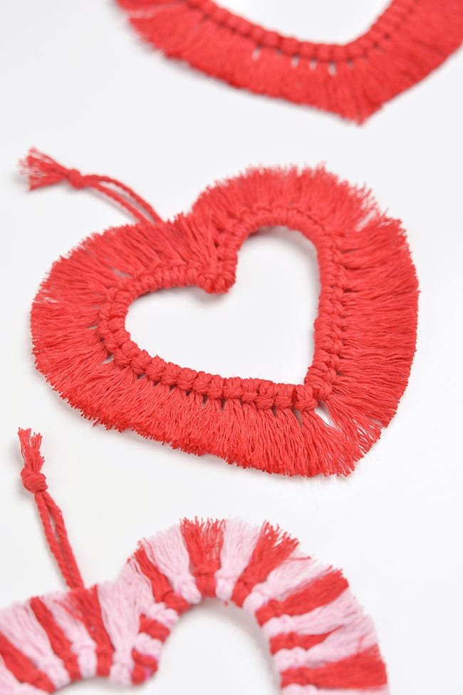 Side angle of fringed macrame hearts