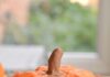 DIY Paper Mache Pumpkins: Step-by-Step Guide Paper mache pumpkin on wood with fall leaves around it