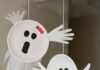 Easy Paper Plate Handprint Ghost Craft for Kids Paper plate ghosts hanging from the ceiling