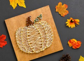 Pumpkin String Art Pumpkin string art signs surrounded by fall leaves and flowers