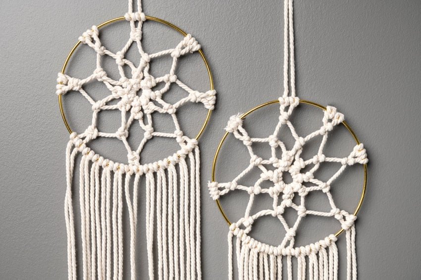 Two macrame dream catchers beside each other