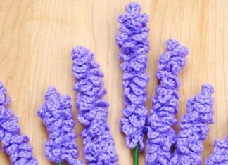 Bundle of crochet lavender flowers on a wood background