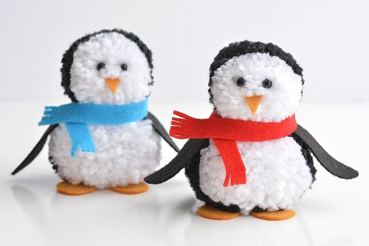 These pom pom penguins are so easy to make and they're sooooooooo cute!! This is such a fun winter craft idea for kids! You can easily make your own pom poms just by using your hands! This is such a fun and easy winter DIY project!