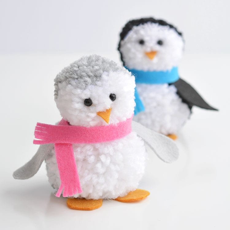 These pom pom penguins are so easy to make and they're sooooooooo cute!! This is such a fun winter craft idea for kids! You can easily make your own pom poms just by using your hands! This is such a fun and easy winter DIY project!