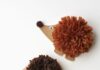 Pom Pom Hedgehogs Three pom pom hedgehogs on a white background