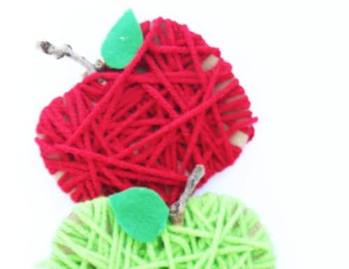 Cardboard Yarn Apples Make some yarn wrapped cardboard apples for a SUPER EASY fall kids craft!