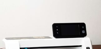 Brother ScanNCut2 CM350E Review: Features, Uses & Comparisons Brother ScanNCut2 CM350e machine scanning a hand-drawn floral design on the cutting mat