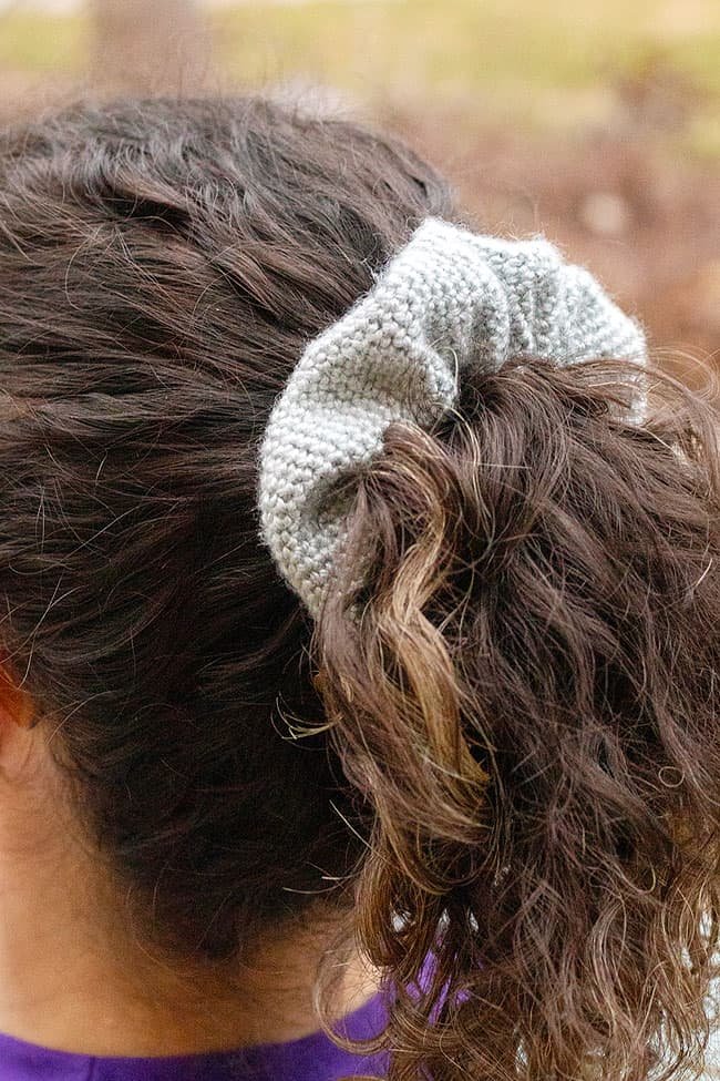 Wearing a crochet scrunchie