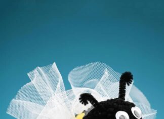 DIY Pom Pom Bees: Fun Craft for Kids Holding a soft and fuzzy DIY pom pom bee craft