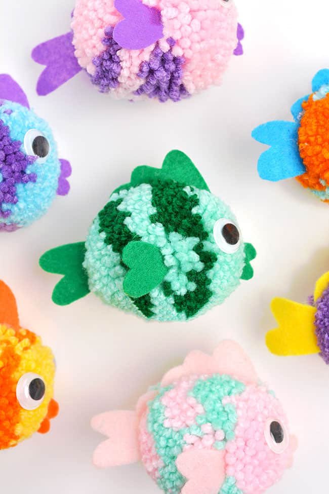 Colourful group of DIY pom pom fish