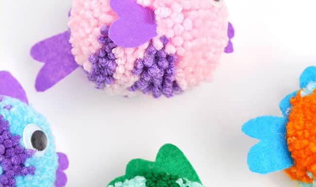 DIY Pom Pom Fish: Simple Craft for Kids Colourful group of DIY pom pom fish