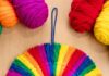 How to Make a Rainbow Tassel Wreath: DIY Craft Guide Rainbow tassel wreath made with colourful yarn