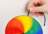 How to Make a String Spinner Toy: DIY Guide Rainbow coloured spinner toy twirling through the air