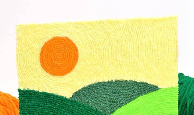 DIY Yarn Art: Creative and Fun Craft Ideas Yarn art displayed on a small easel stand