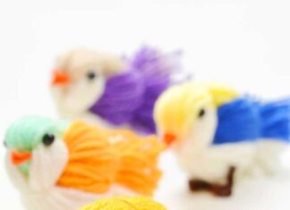 How to Make a Yarn Bird Group of DIY yarn birds on a white background