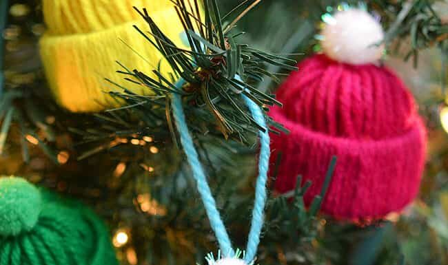 How to Make Yarn Hat Ornaments Colourful yarn hat ornaments on a Christmas tree
