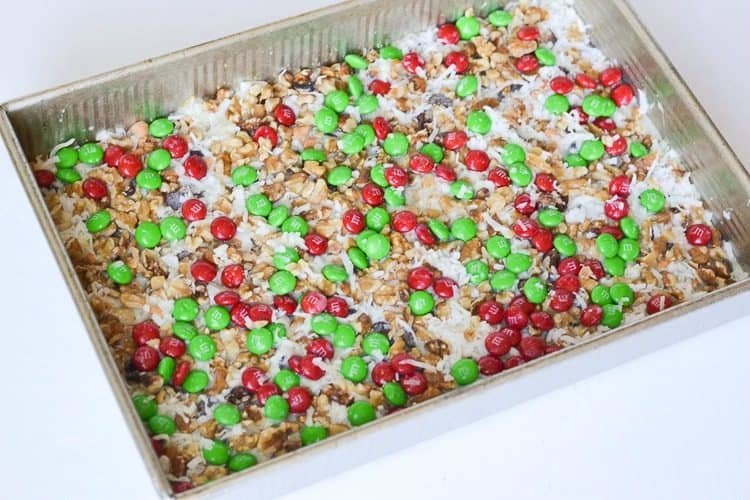 These Christmas magic cookie bars are a perfect treat to serve at a holiday party, just cut into bite size pieces and serve for a delicious holiday treat!