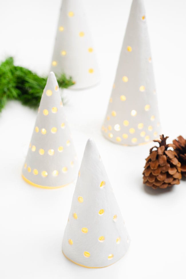 Clay Christmas Trees Group of white clay Christmas trees lit by battery operated candles
