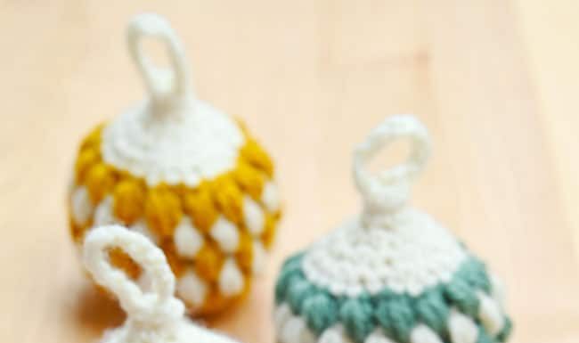 How to Make a Crochet Christmas Ornament Crochet Christmas baubles on a wood background