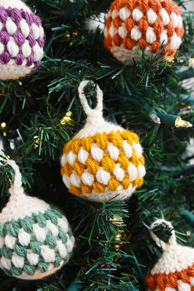 Crochet ornaments hanging on a Christmas tree