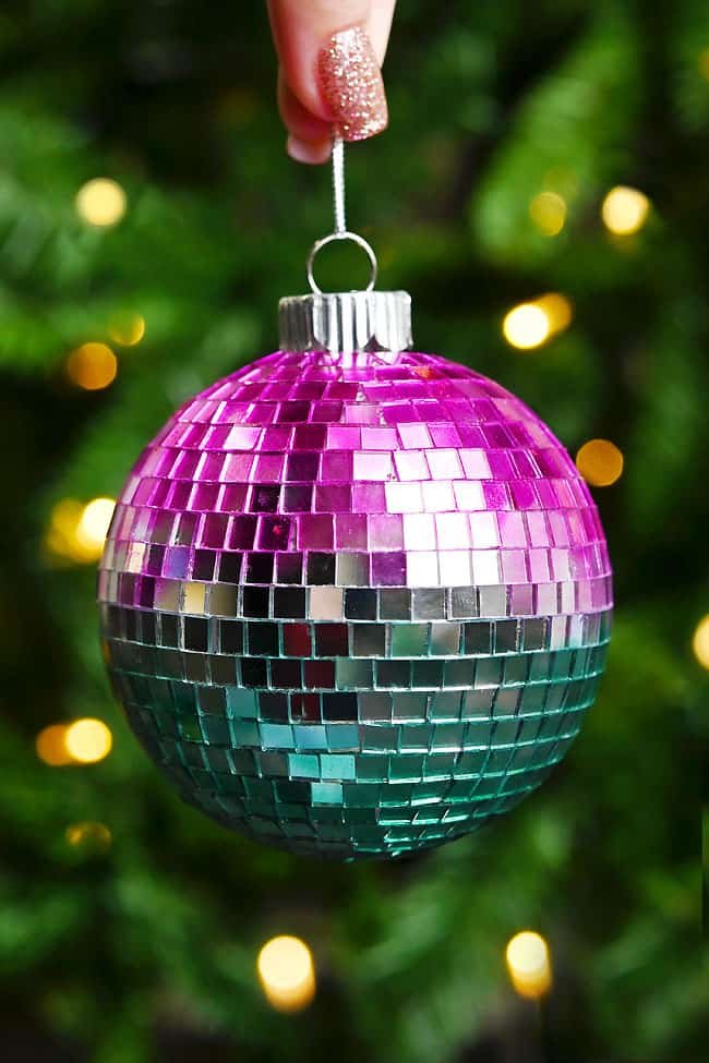 Disco ball ornament held by its string