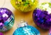 DIY Disco Ball Ornaments Disco ball ornament surrounded by other mirror ball ornaments