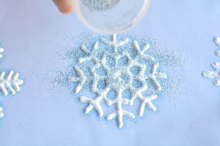 These snowflake window clings are so easy to make and they end up looking SO PRETTY! They're a great decoration that can be left up all winter!