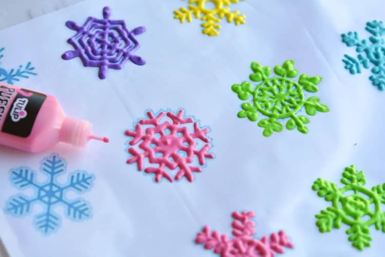 These snowflake window clings are so easy to make and they end up looking SO PRETTY! They're a great decoration that can be left up all winter!