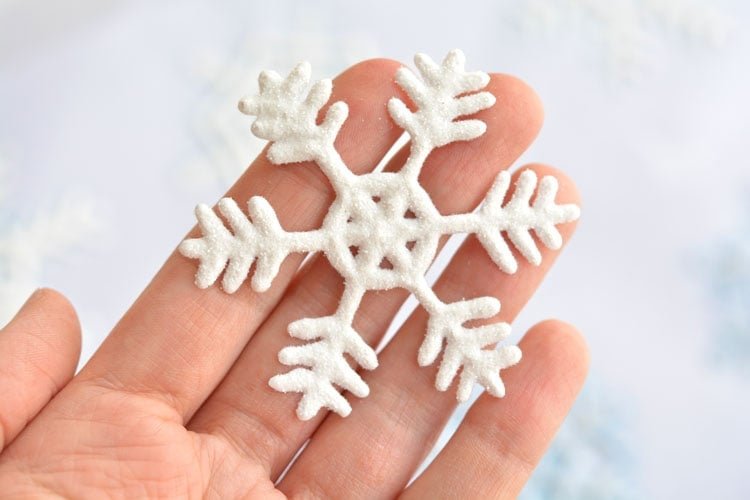 These snowflake window clings are so easy to make and they end up looking SO PRETTY! They're a great decoration that can be left up all winter!