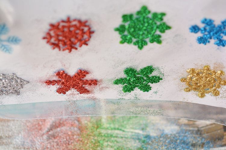 These snowflake window clings are so easy to make and they end up looking SO PRETTY! They're a great decoration that can be left up all winter!