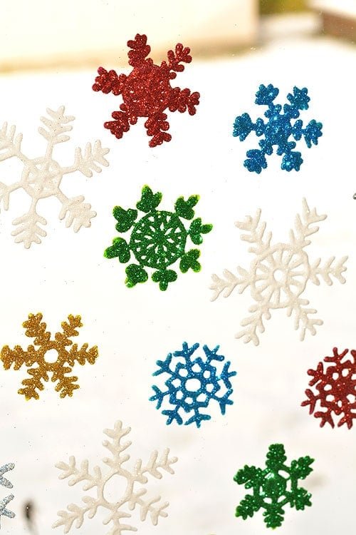 These snowflake window clings are so easy to make and they end up looking SO PRETTY! They're a great decoration that can be left up all winter!