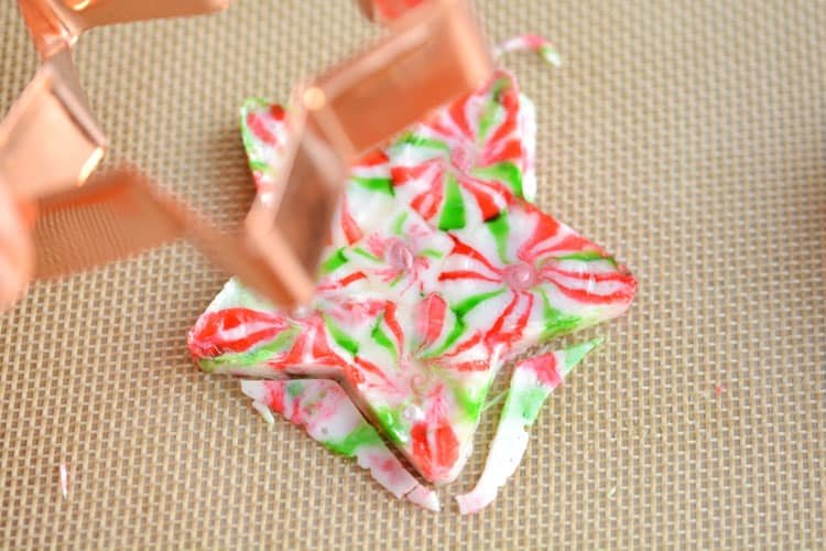 These melted peppermint candy ornaments are ADORABLE and they're super easy to make! Such a fun and inexpensive homemade Christmas ornament idea to make with the kids!