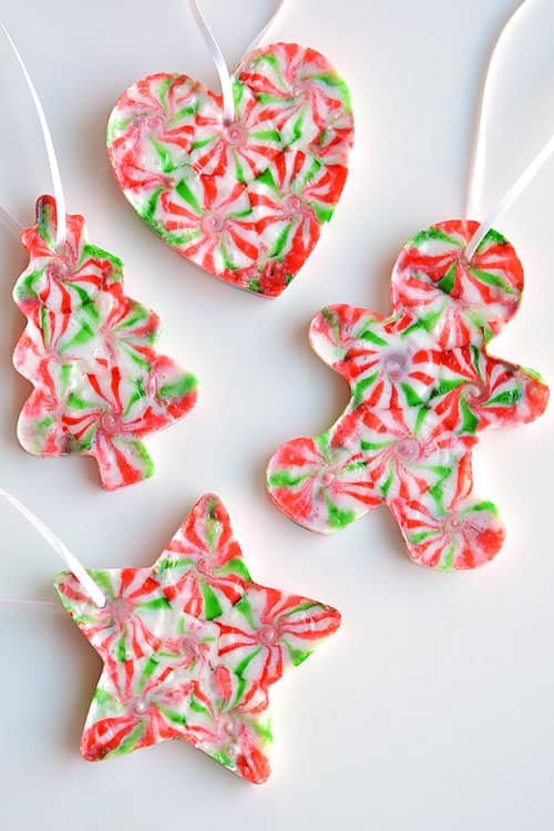 These melted peppermint candy ornaments are ADORABLE and they're super easy to make! Such a fun and inexpensive homemade Christmas ornament idea to make with the kids!