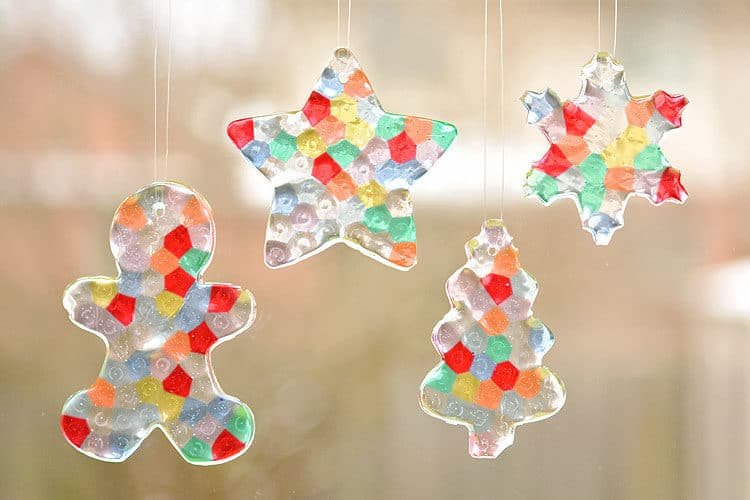 Gingerbread, star, tree, and snowflake ornaments made of melted beads