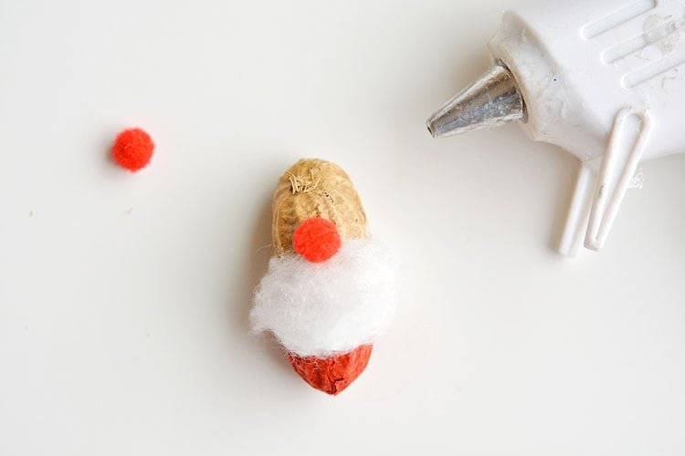 These peanut Christmas ornaments are SO ADORABLE and they're really easy to make! They're such a fun and simple Christmas craft to make with the kids!