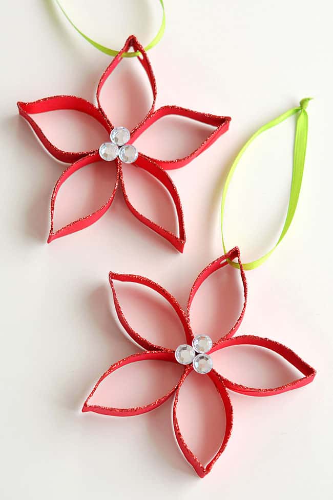 These paper roll poinsettias are SO FUN and they're really simple to make! This is such a great Christmas craft and a super fun homemade ornament to make with the kids! Who knew you could transform a simple paper roll into something so beautiful!? Such a great recycled craft! These paper roll poinsettias are SO FUN and they're really simple to make! This is such a great Christmas craft and a super fun homemade ornament to make with the kids! Who knew you could transform a simple paper roll into something so beautiful!? Such a great recycled craft!