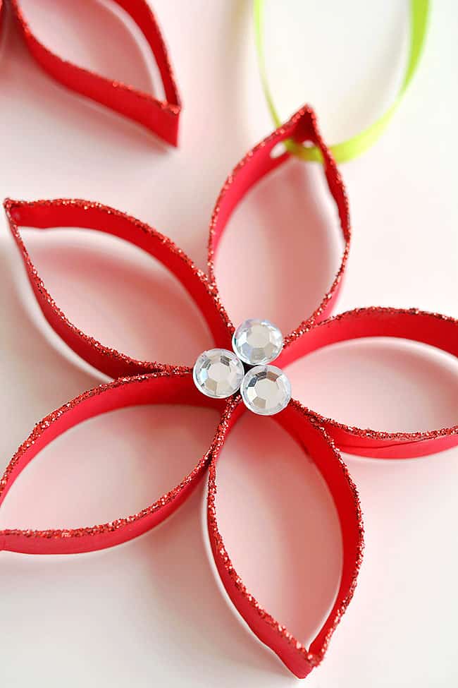 These paper roll poinsettias are SO FUN and they're really simple to make! This is such a great Christmas craft and a super fun homemade ornament to make with the kids! Who knew you could transform a simple paper roll into something so beautiful!? Such a great recycled craft! These paper roll poinsettias are SO FUN and they're really simple to make! This is such a great Christmas craft and a super fun homemade ornament to make with the kids! Who knew you could transform a simple paper roll into something so beautiful!? Such a great recycled craft!