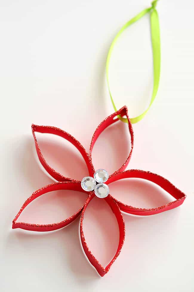 These paper roll poinsettias are SO FUN and they're really simple to make! This is such a great Christmas craft and a super fun homemade ornament to make with the kids! Who knew you could transform a simple paper roll into something so beautiful!? Such a great recycled craft! These paper roll poinsettias are SO FUN and they're really simple to make! This is such a great Christmas craft and a super fun homemade ornament to make with the kids! Who knew you could transform a simple paper roll into something so beautiful!? Such a great recycled craft!